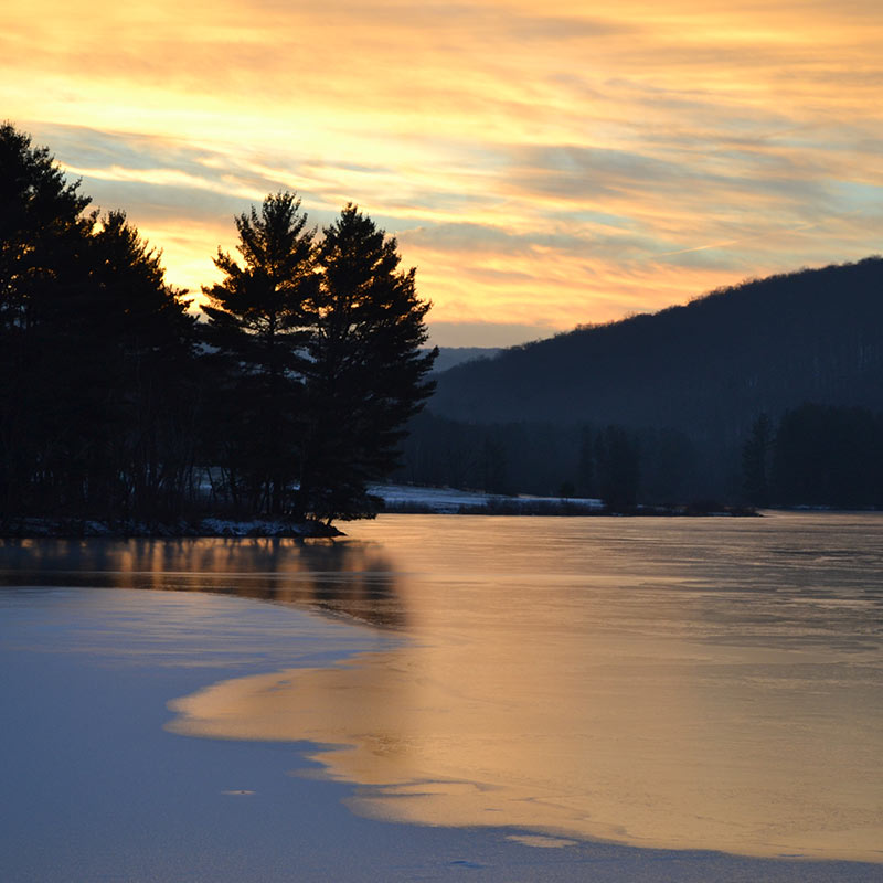 early morning sunrise at quaker lake.