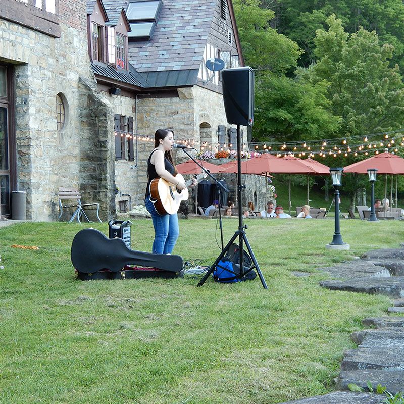 outdoor solo guitarist performing out from of Allegany Red House.